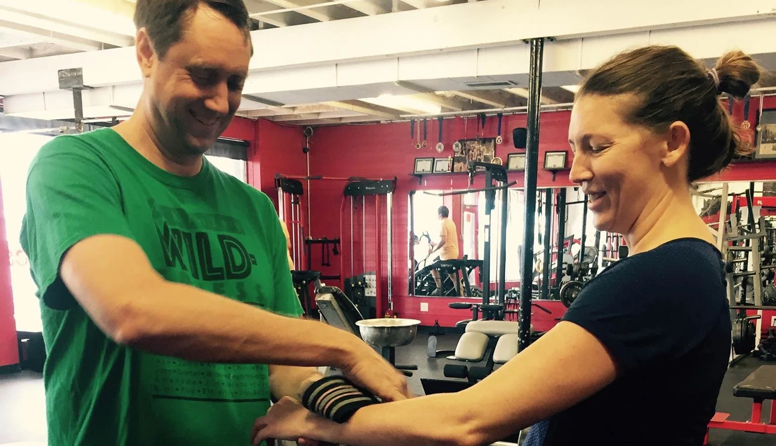 Clients lifting weights together