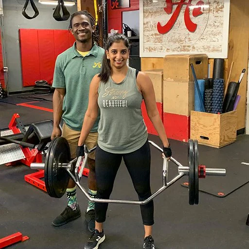 client highlight doing a hex bar deadlift