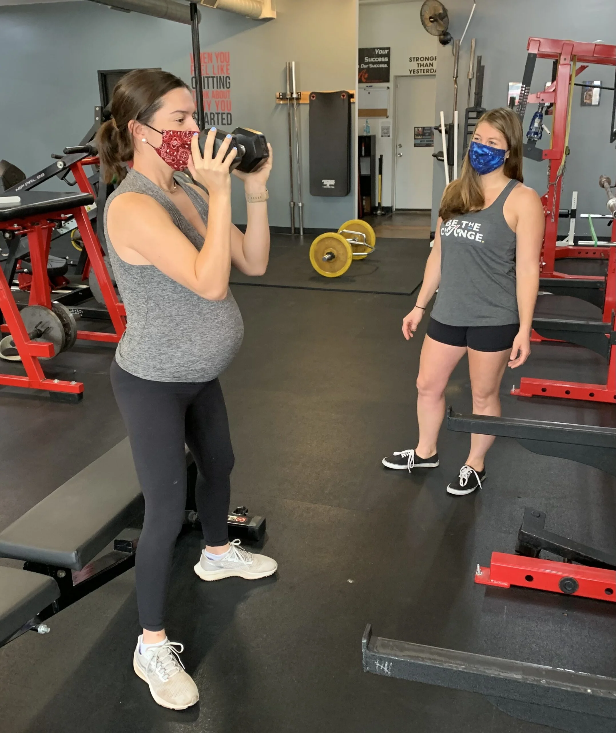 Pregnant client performing a squat