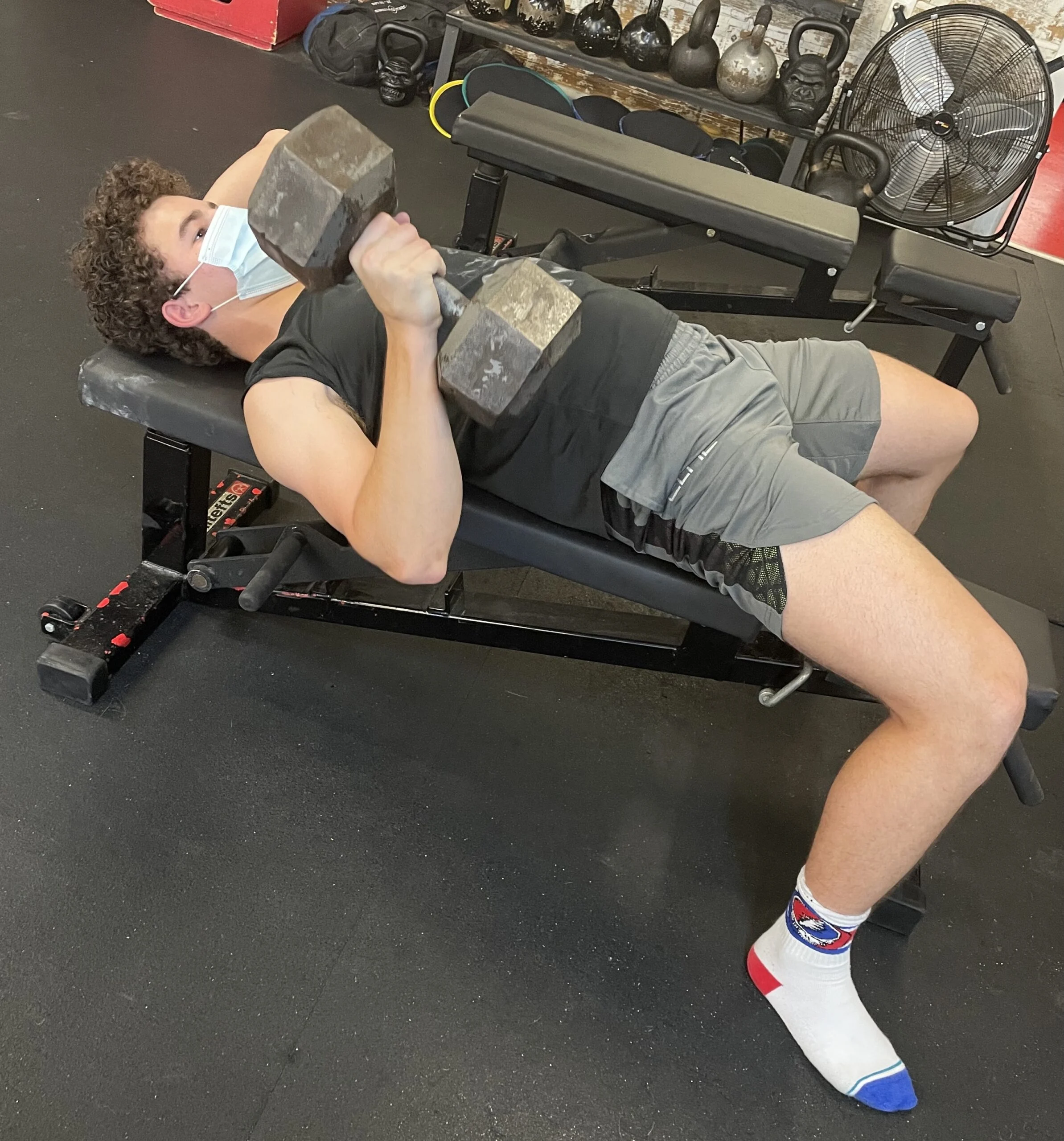 Client doing a dumbbell bench press