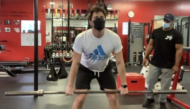 Client lifting a barbell