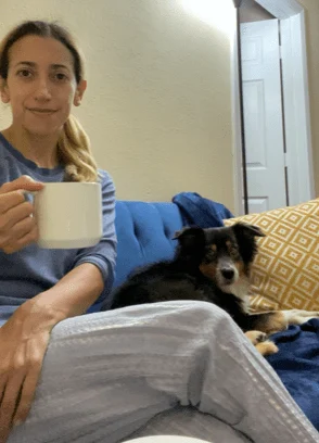 Vilita enjoying coffee with her dog