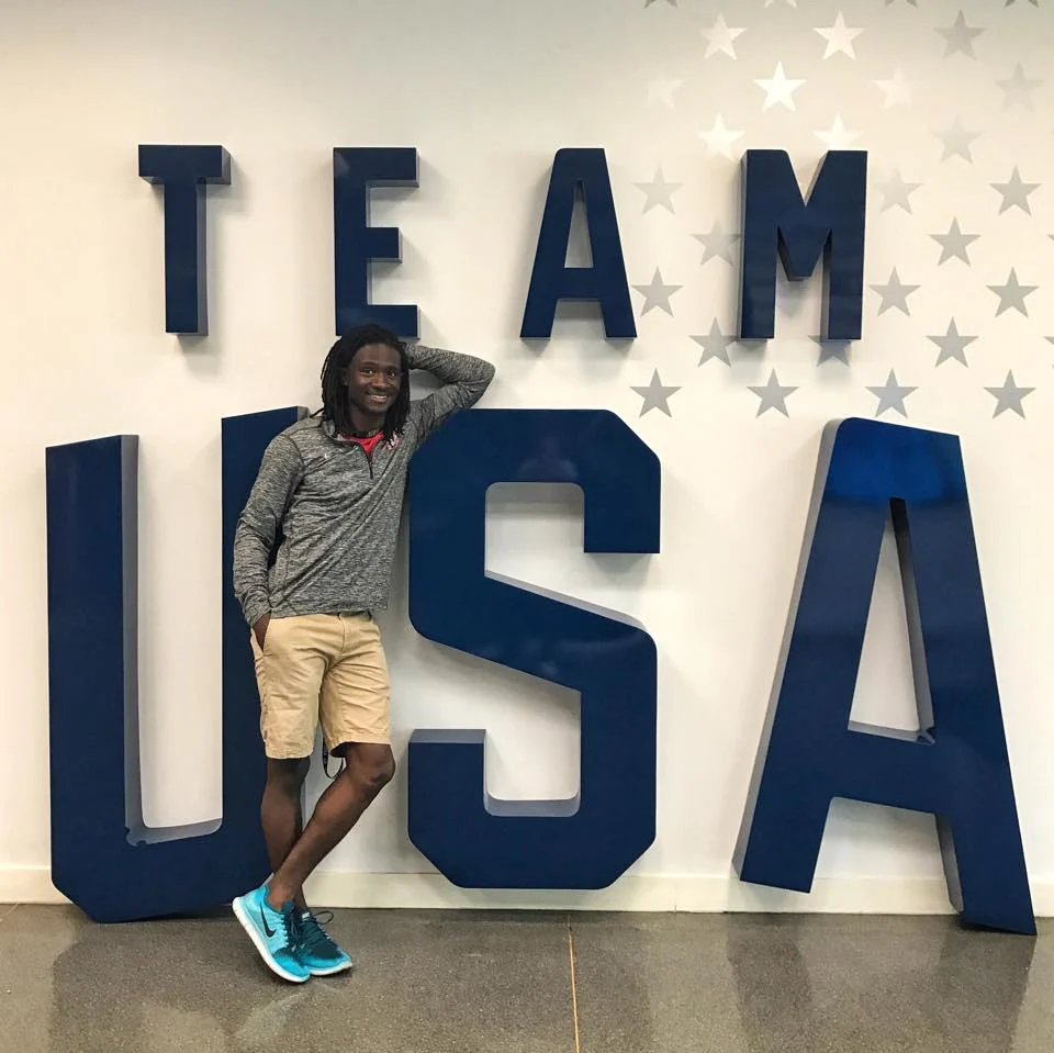 Darryl posing with a Team USA marquee