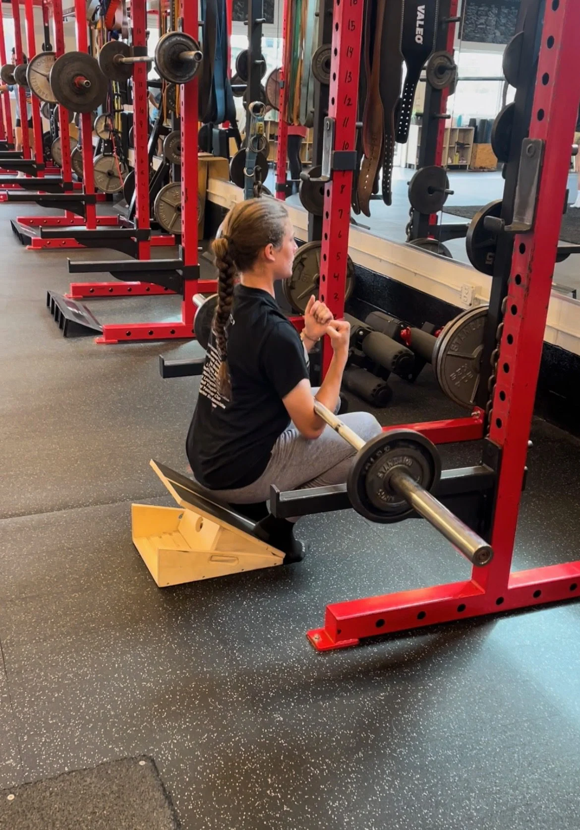 Sports performance client doing a zercher squat