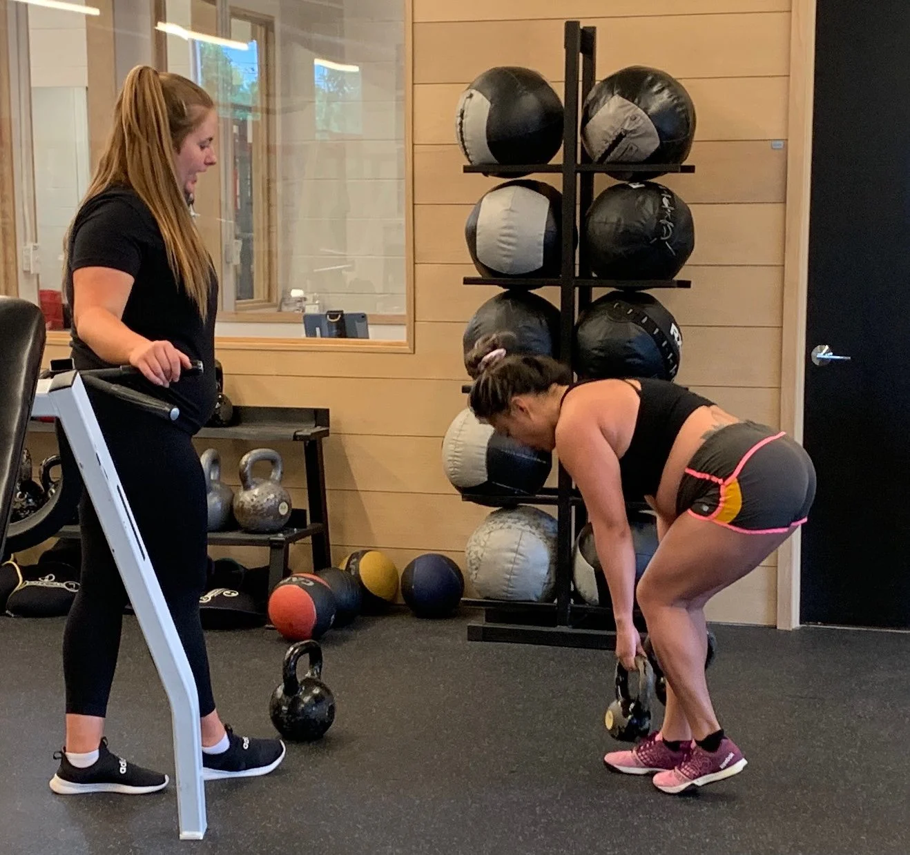Client doing a kettlebell deadlift
