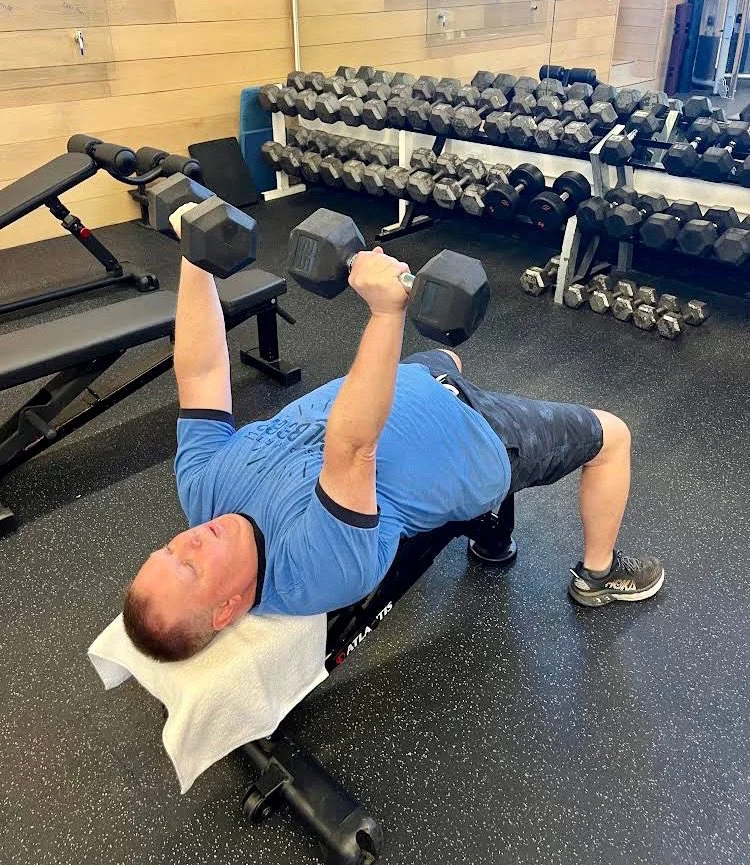 Client Highlight doing a dumbbell bench press