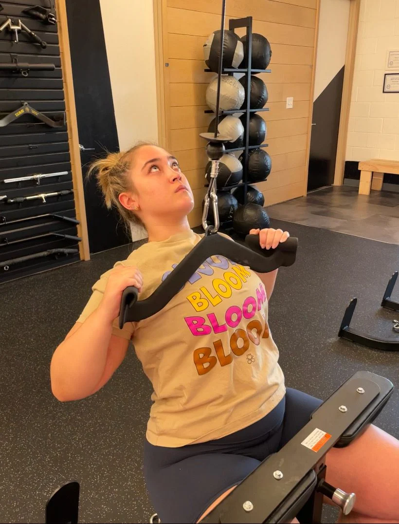 Delaney performing a lat pull down