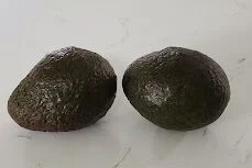 two avocados