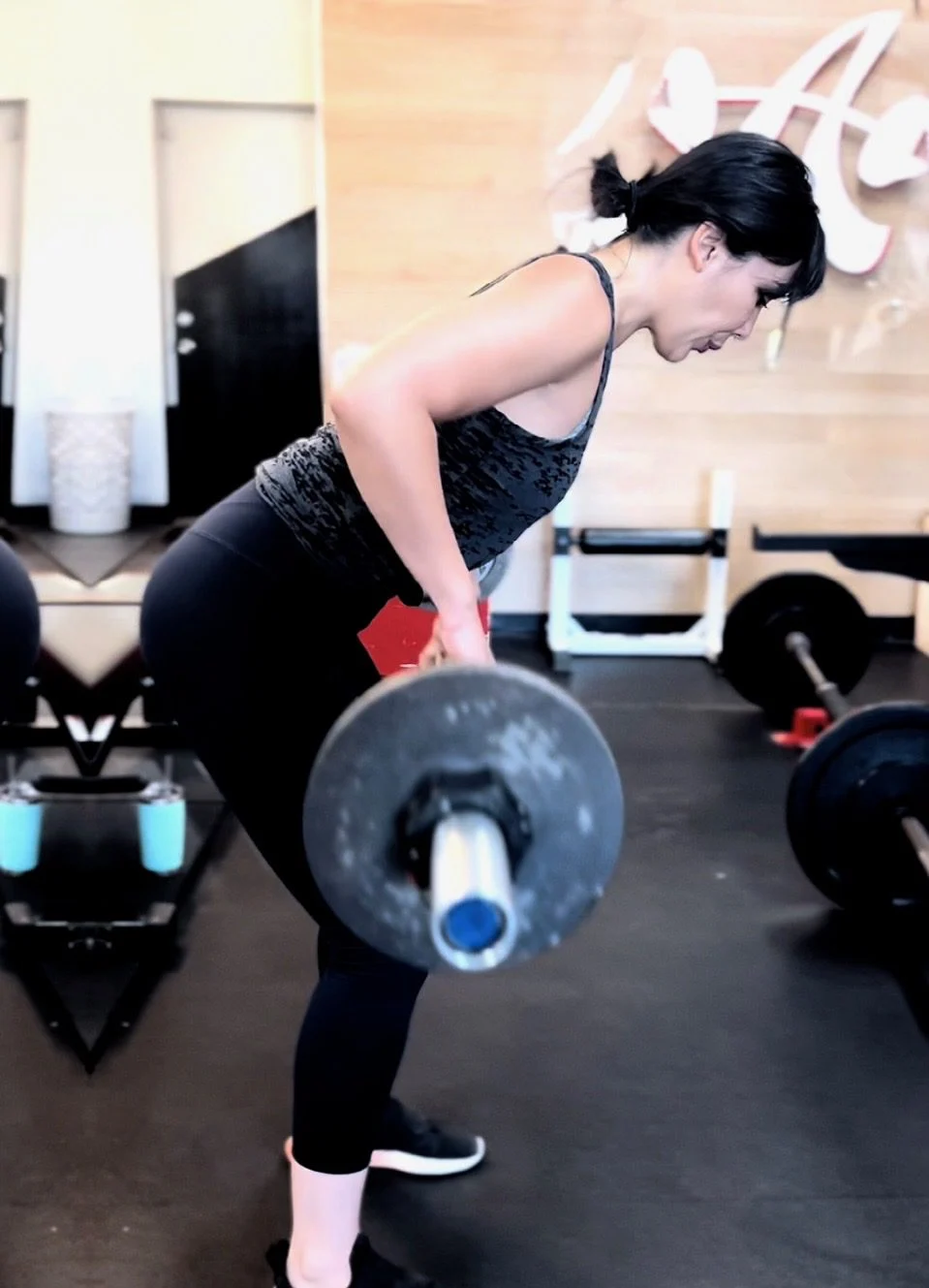 Krystel doing a barbell row