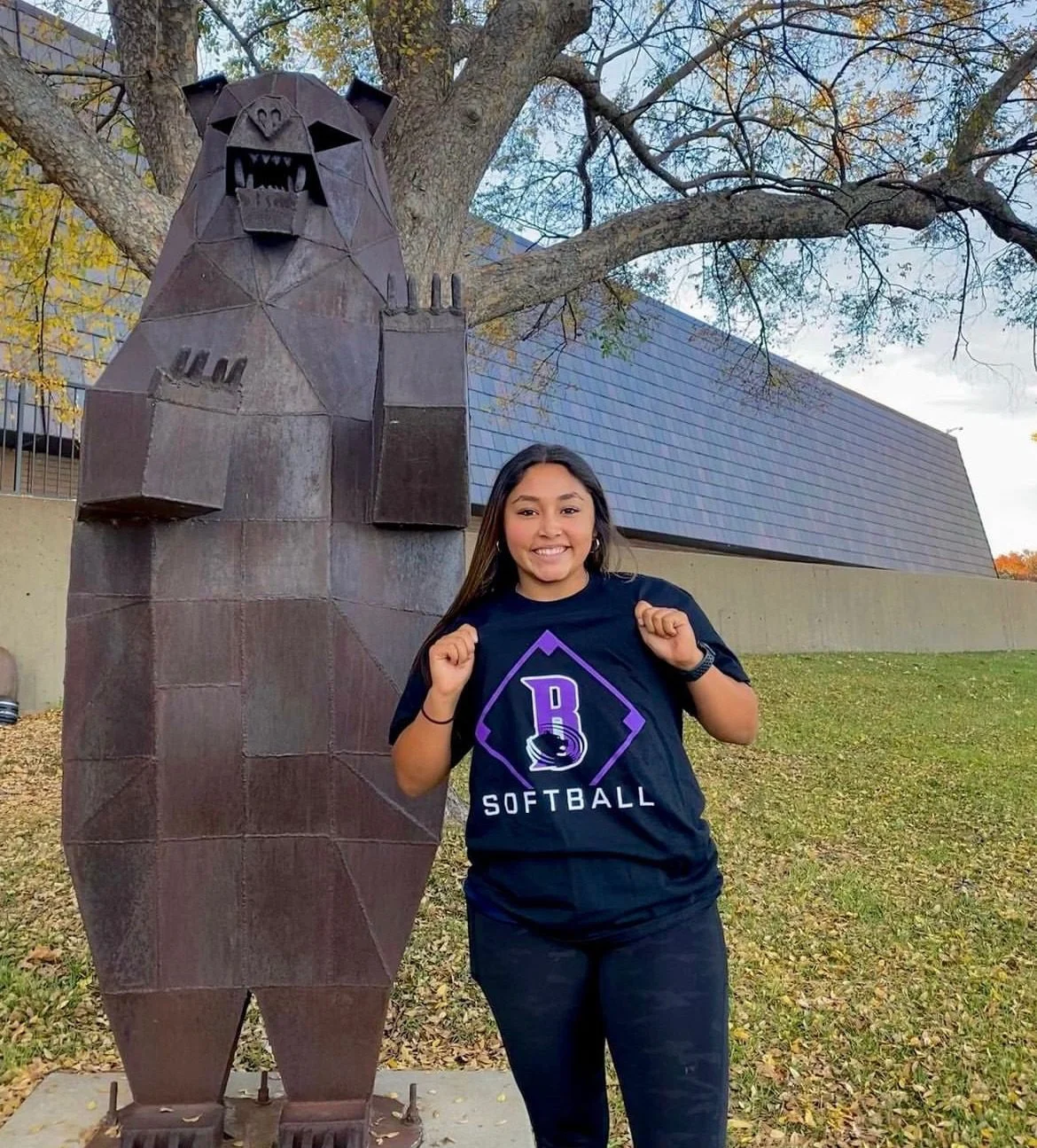 Sports performance highlight with a bear statue