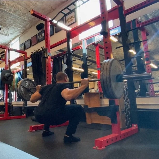 Personal trainer Eric Brooks performing a back squat