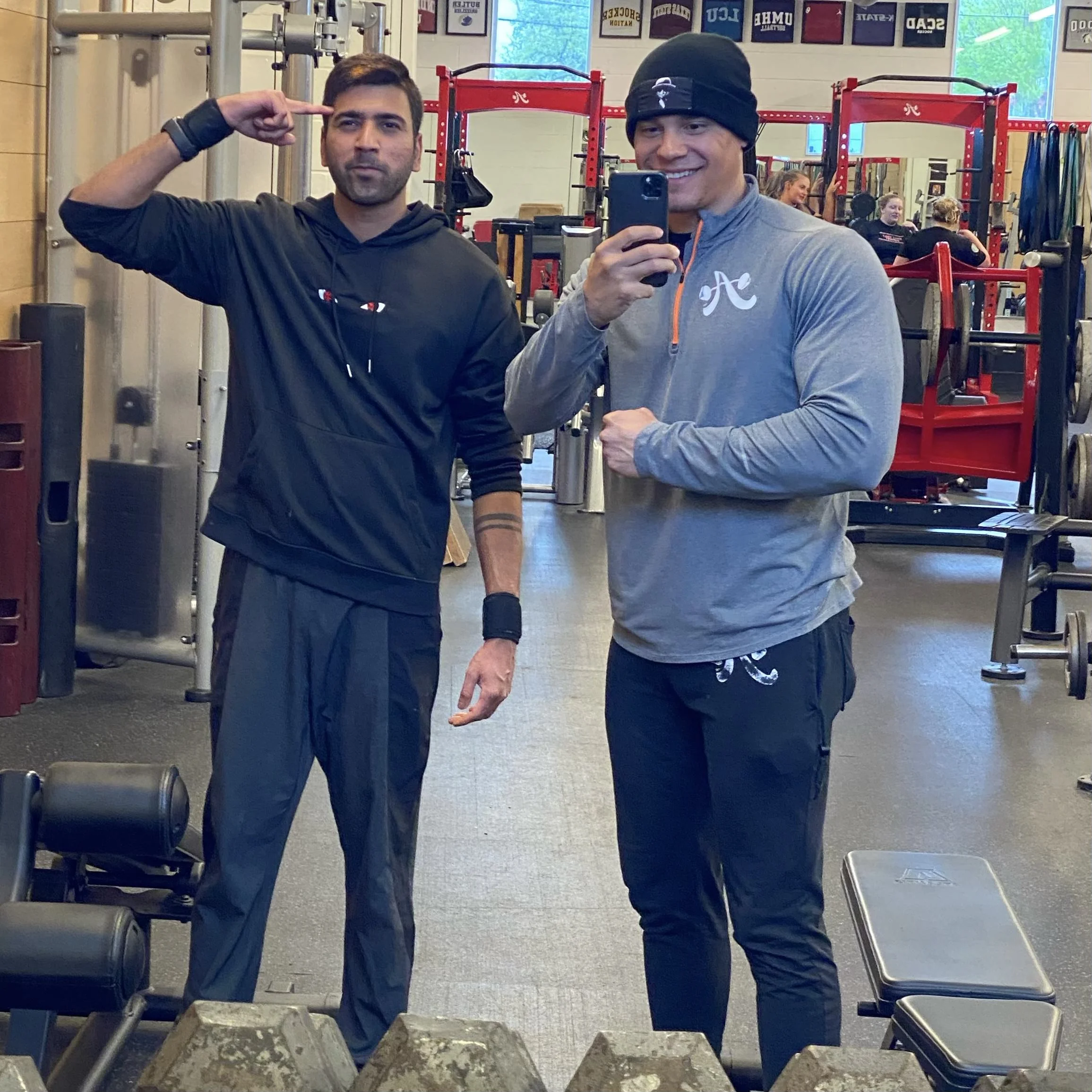 client highlight posing with trainer