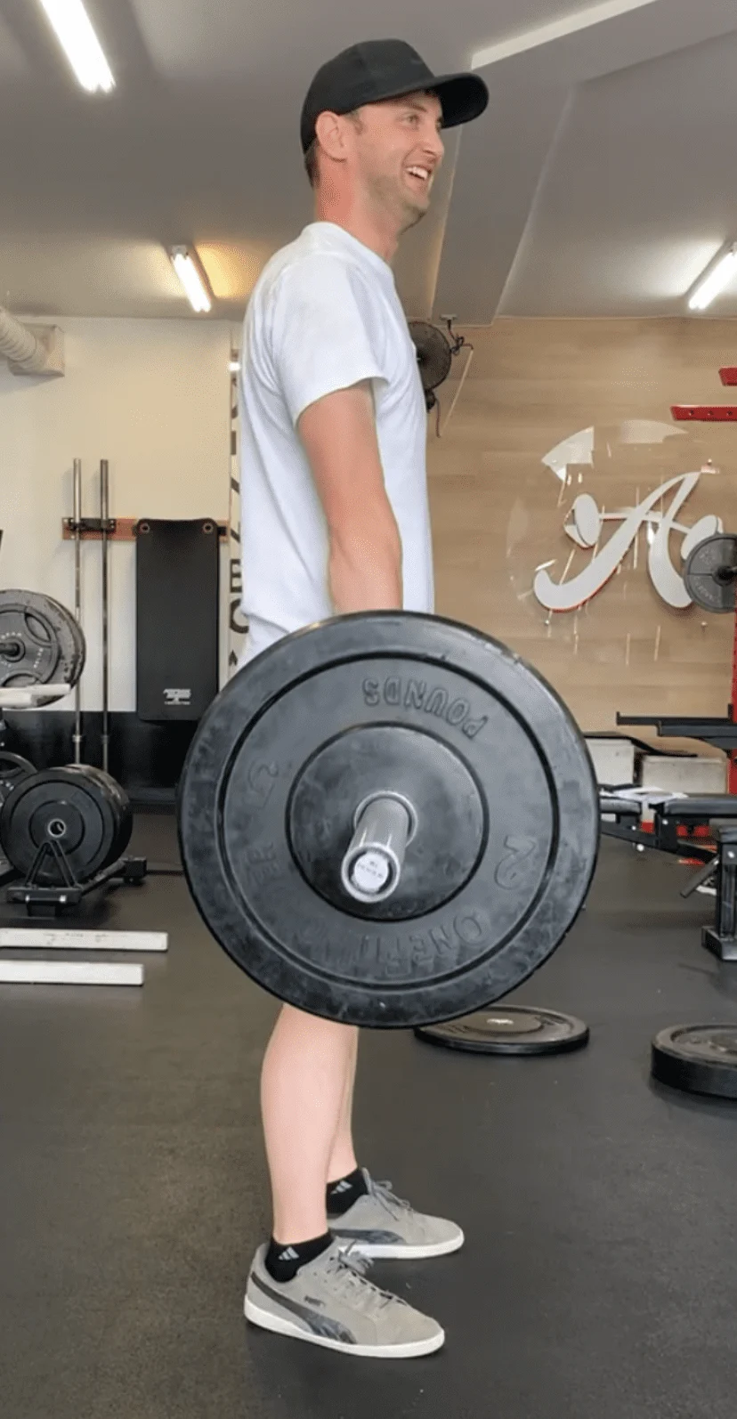 client highlight holding a barbell