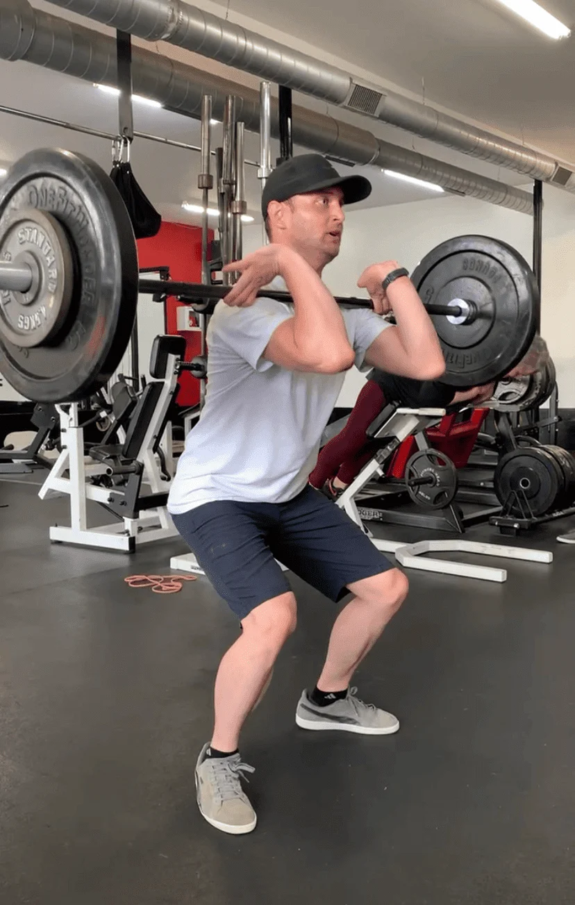 client highlight doing a front squat