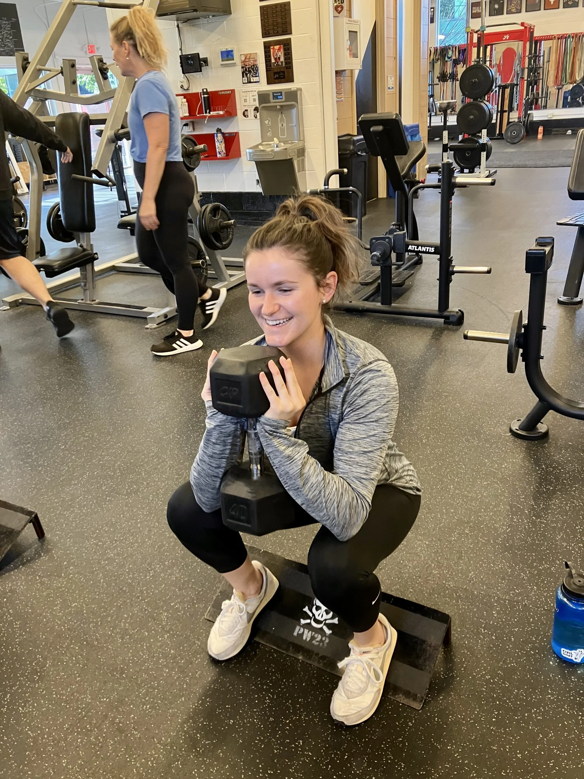 client doing a goblet squat