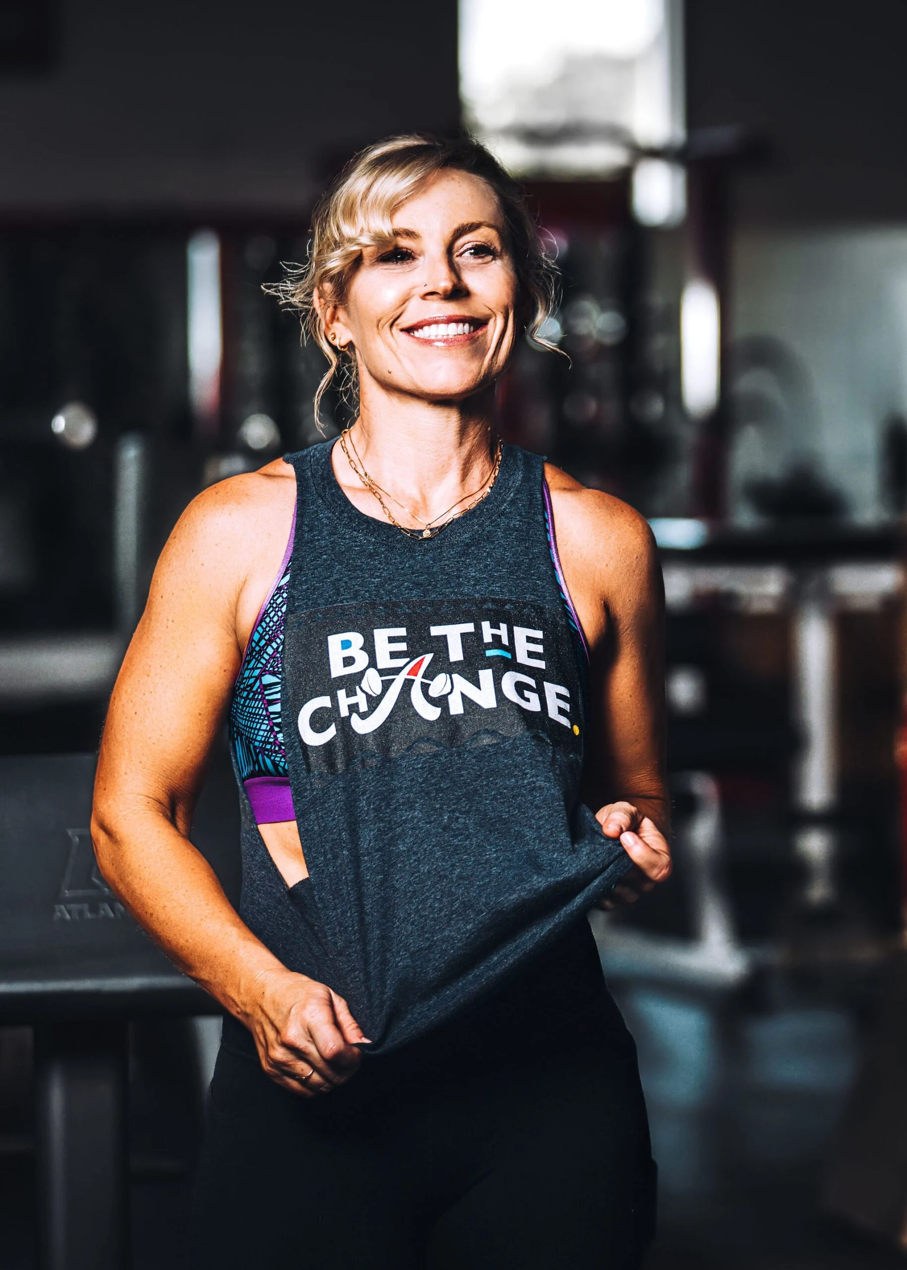 Krista wearing a Be the Change tank top