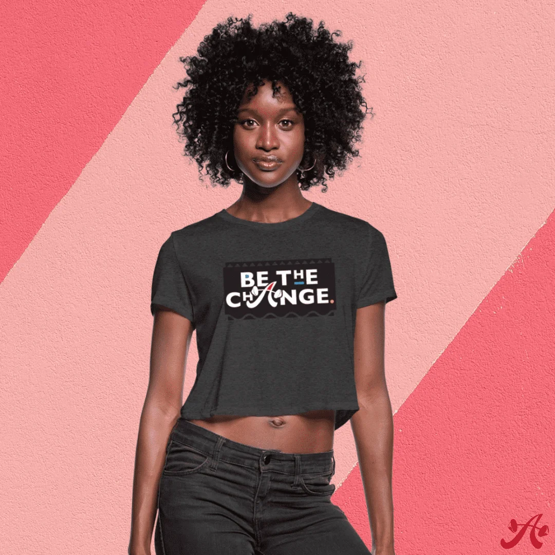 Model in a Be the Change cropped tee shirt