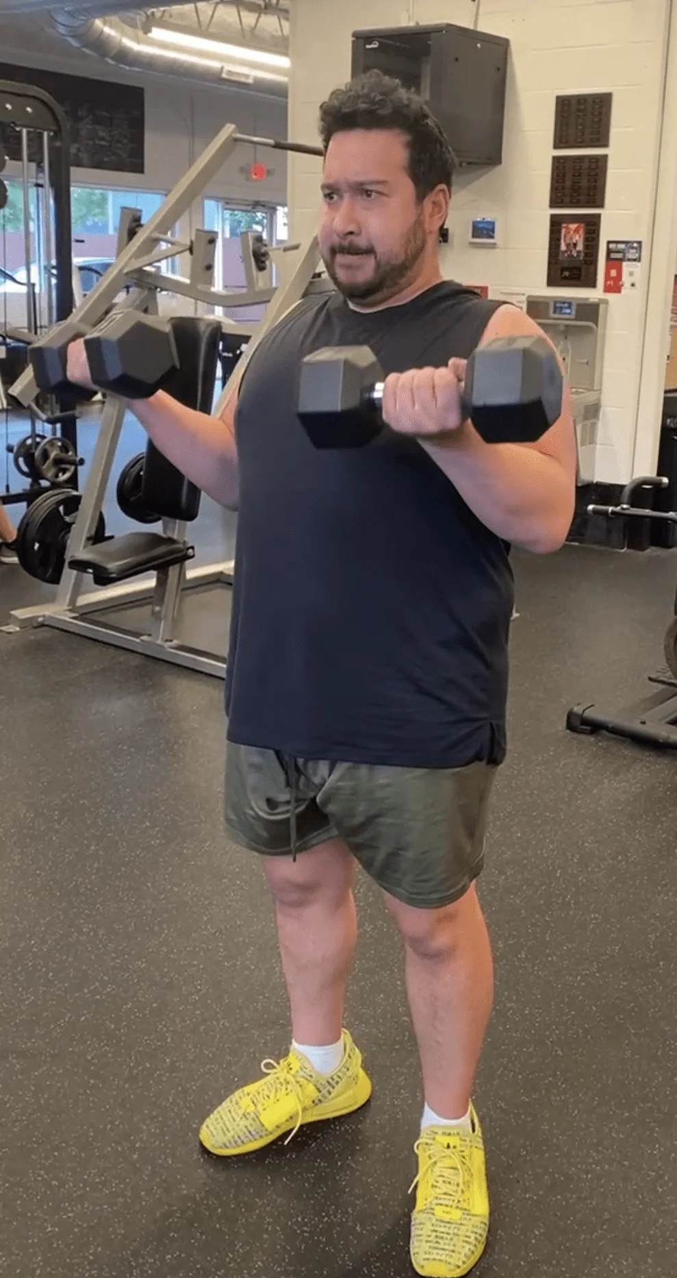 client highlight performing a dumbbell biceps curl