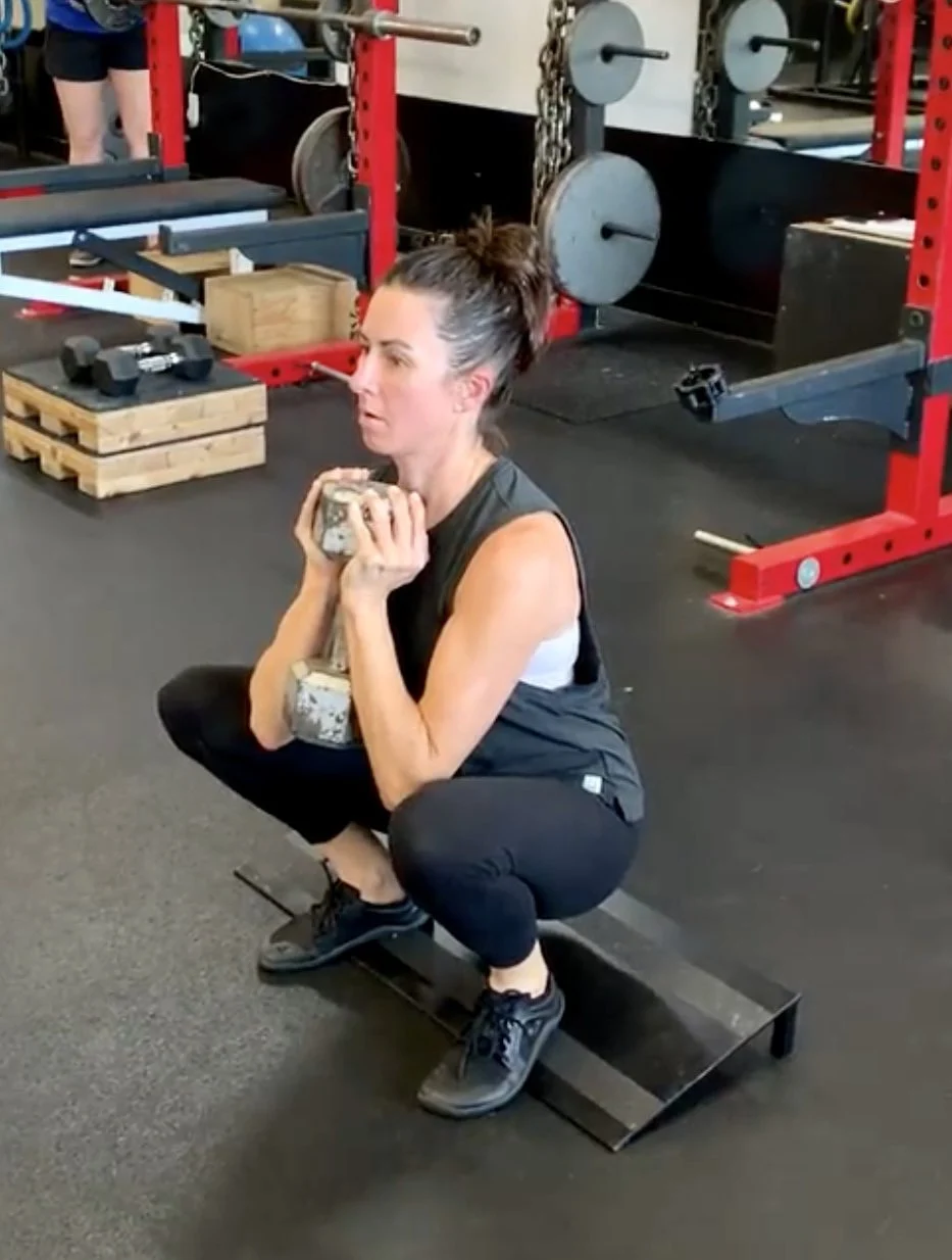 Person doing a goblet squat