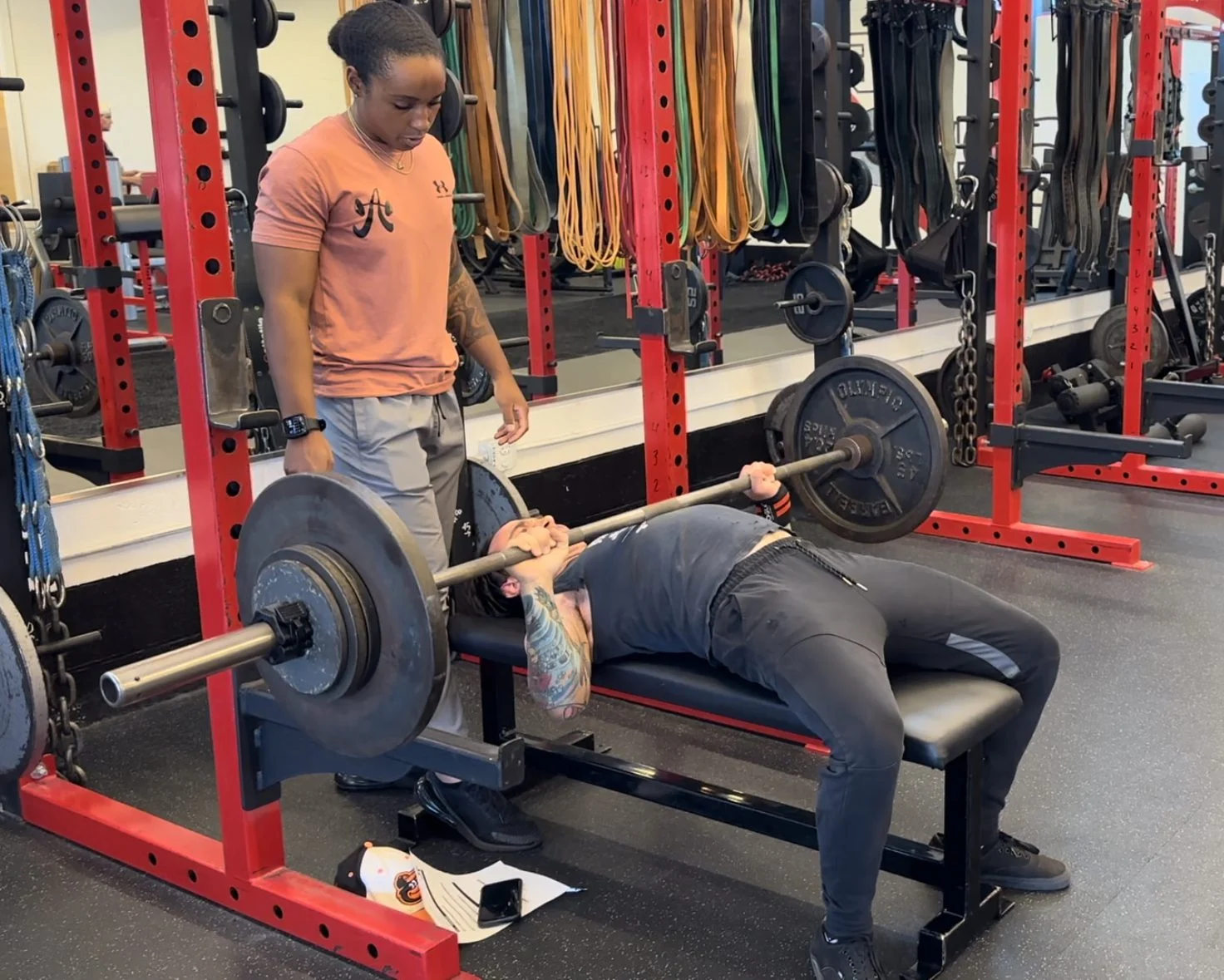 Personal trainer Sierra Nevels coaching a high effort bench press