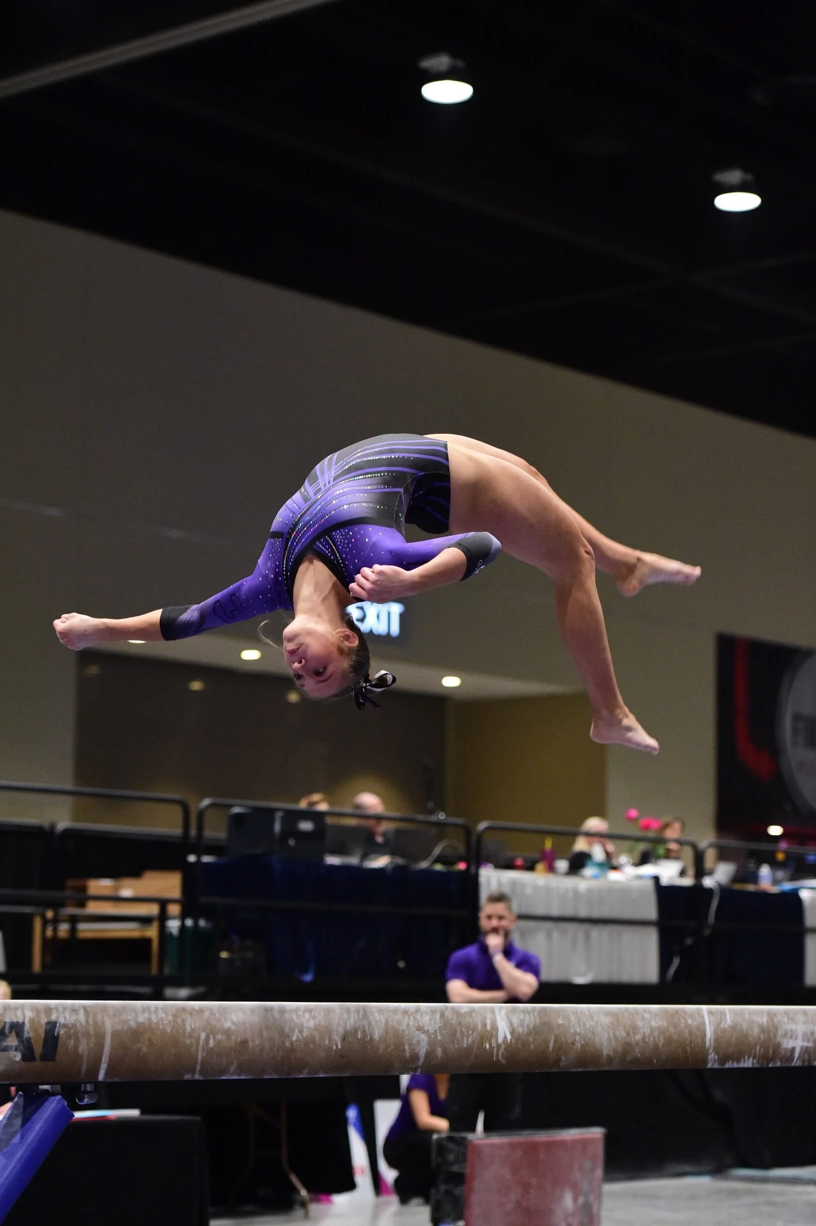 Sports Performance highlight doing a backflip on a balance beam