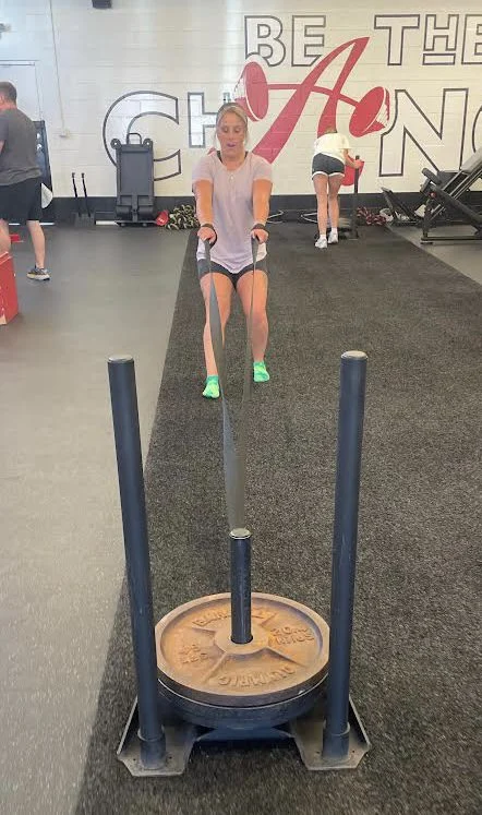 client pulling the weight sled