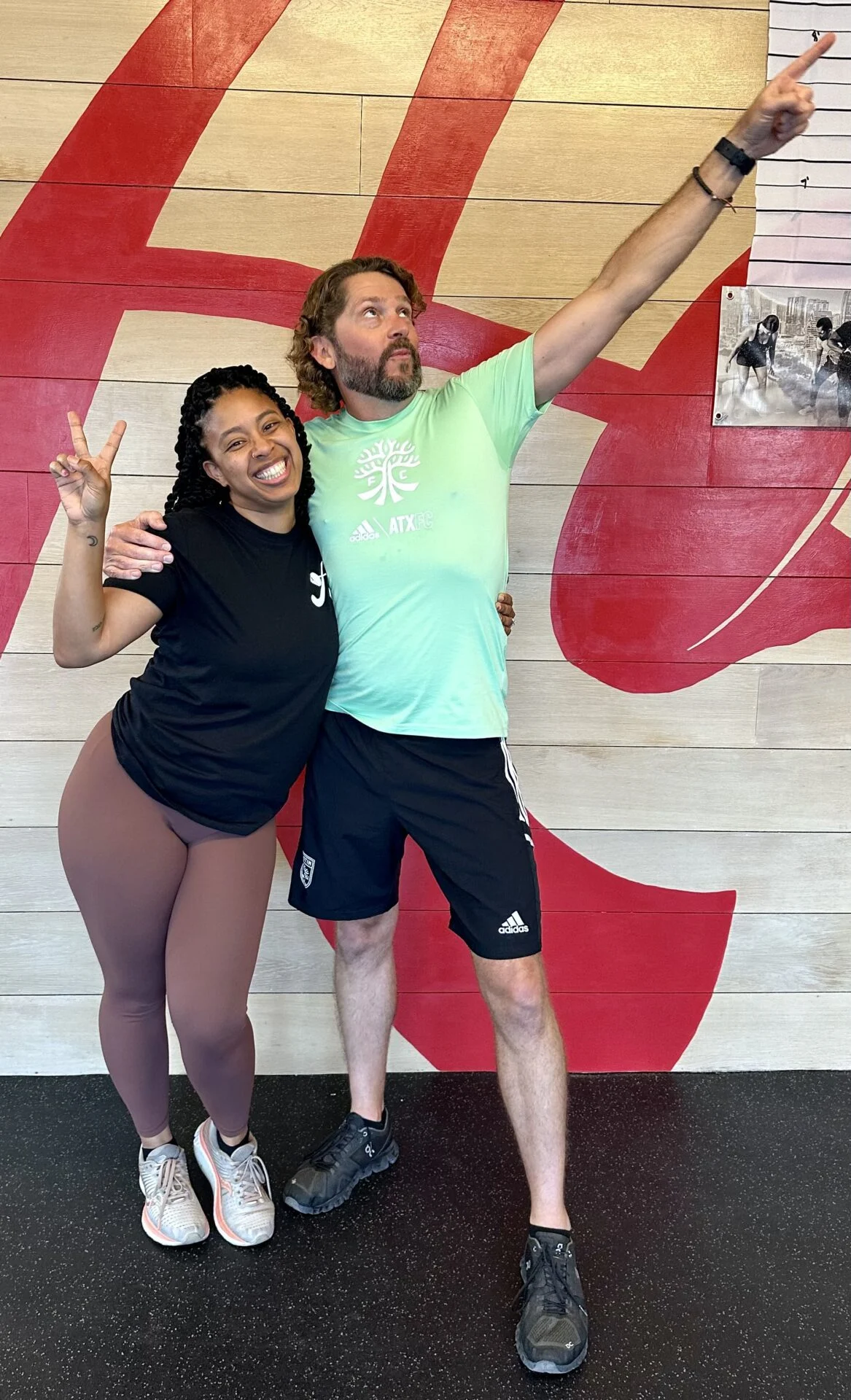 client highlight and his trainer posing