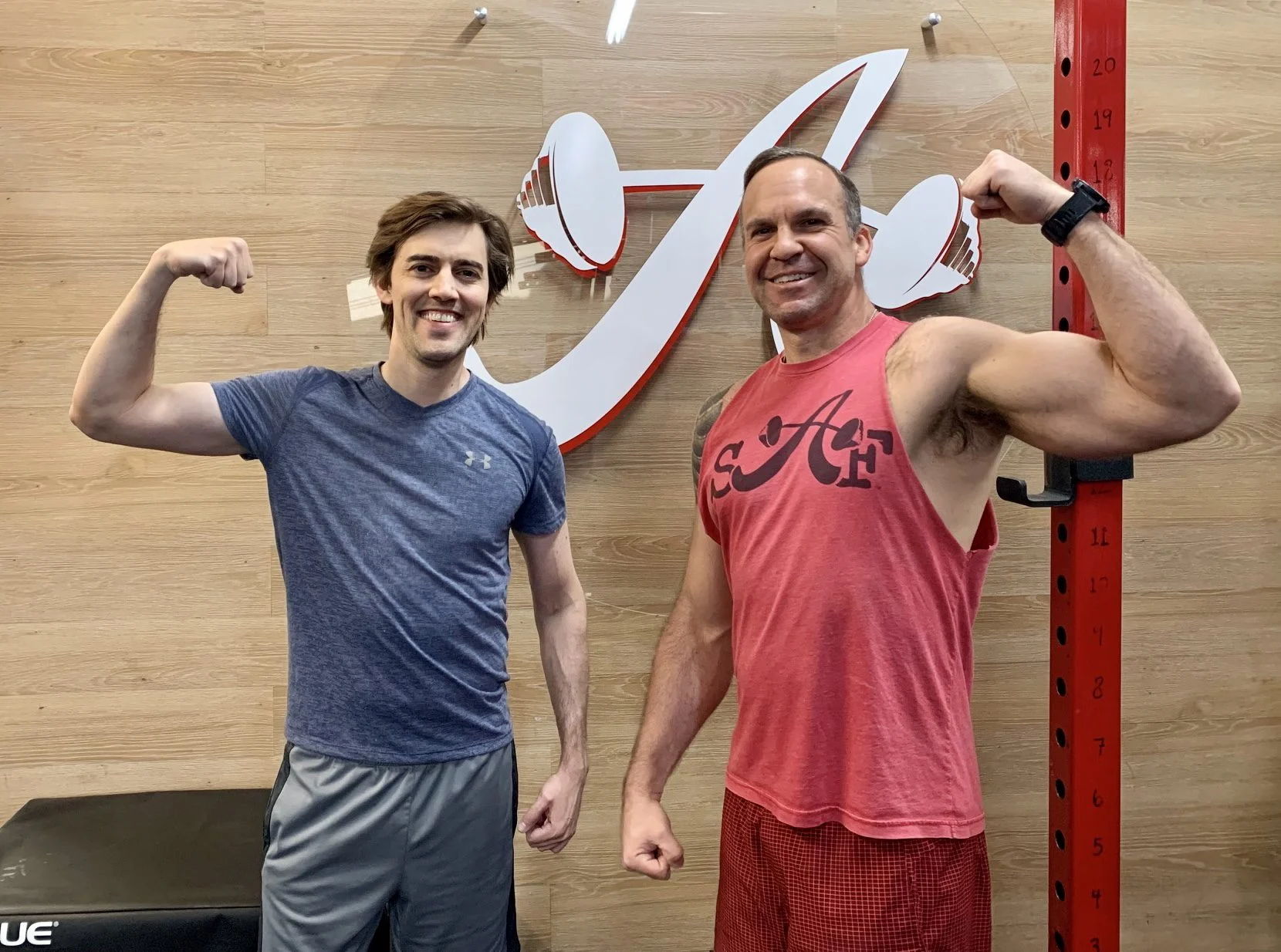 client highlight with his trainer flexing