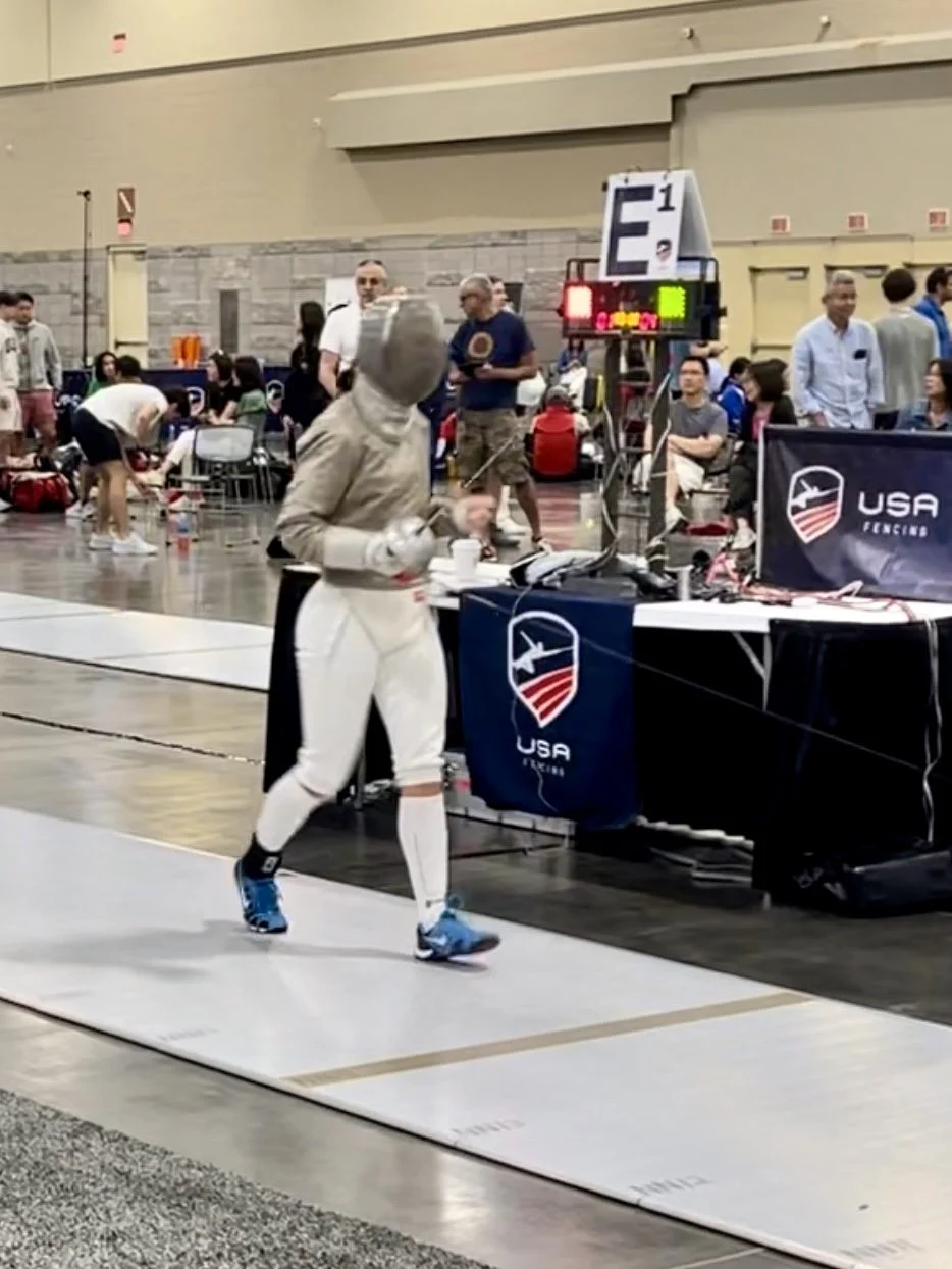 sports performance client in a fencing competition