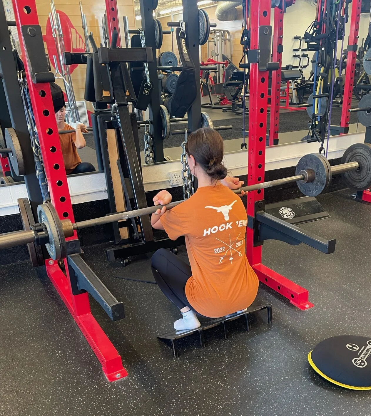 Sports performance client doing a front squat