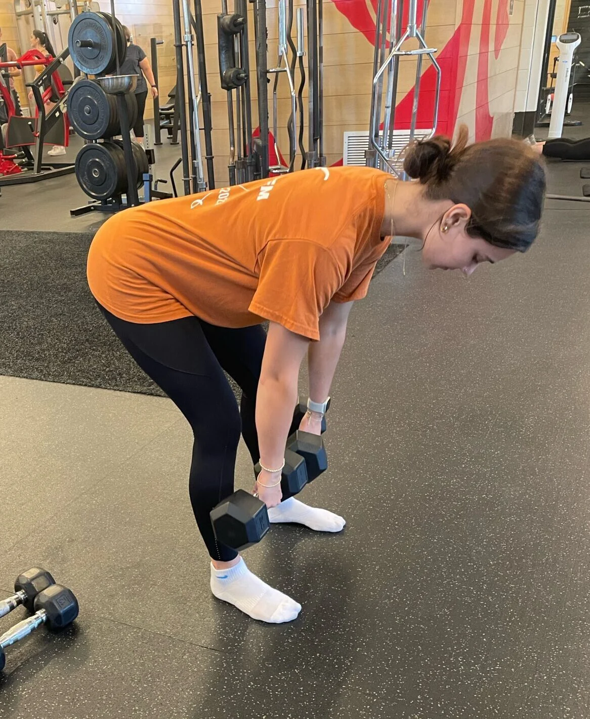client doing a Romanian deadlift