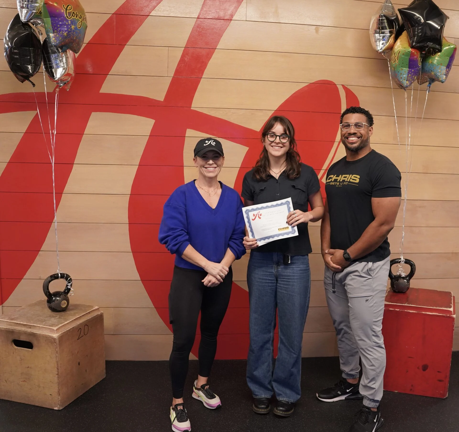 Krista and Chris with a scholarship recipient
