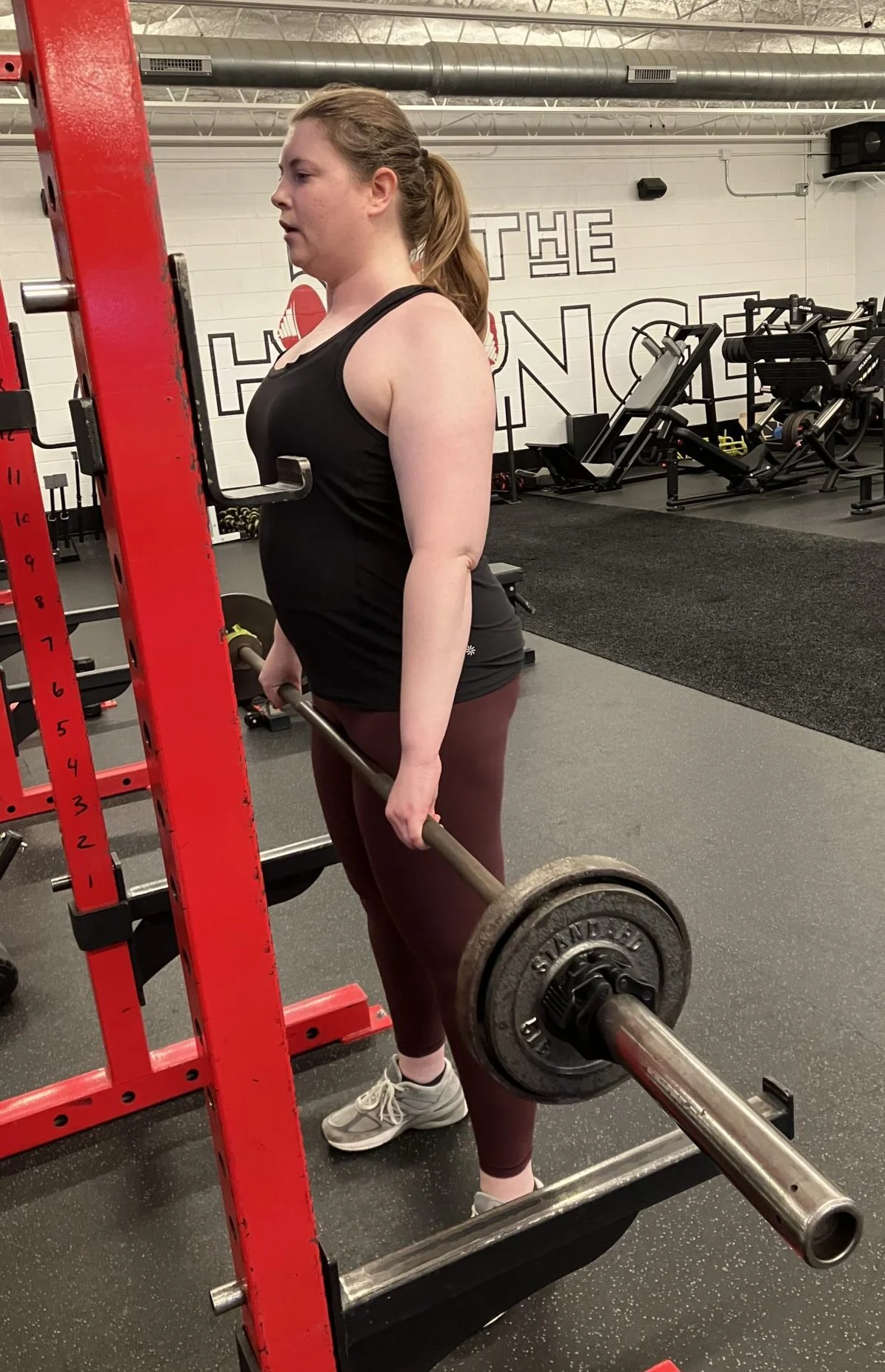 Rebecca doing a barbell rack pull