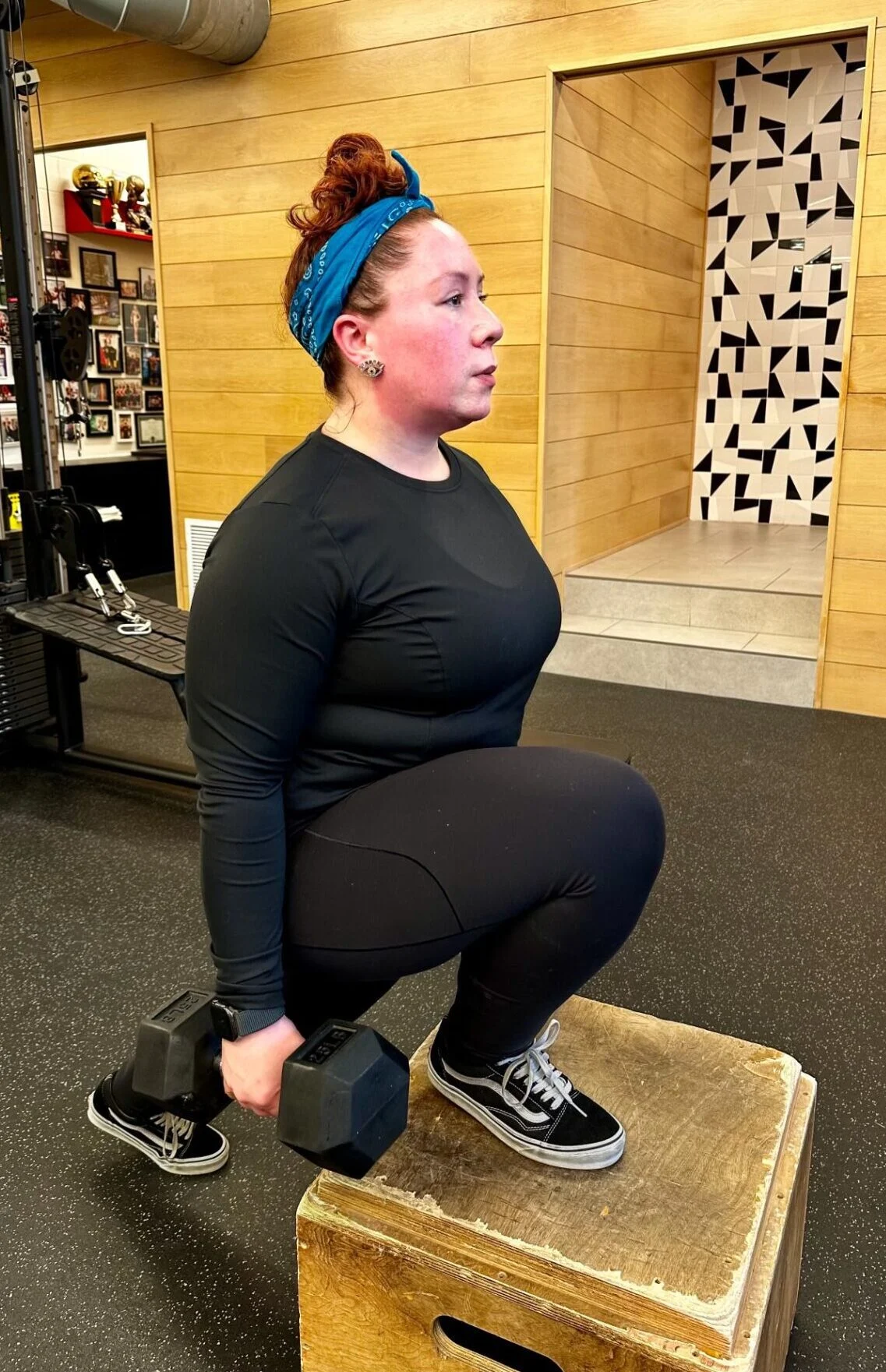 Client highlight Andrea doing a front foot elevated split squat with a dumbbell