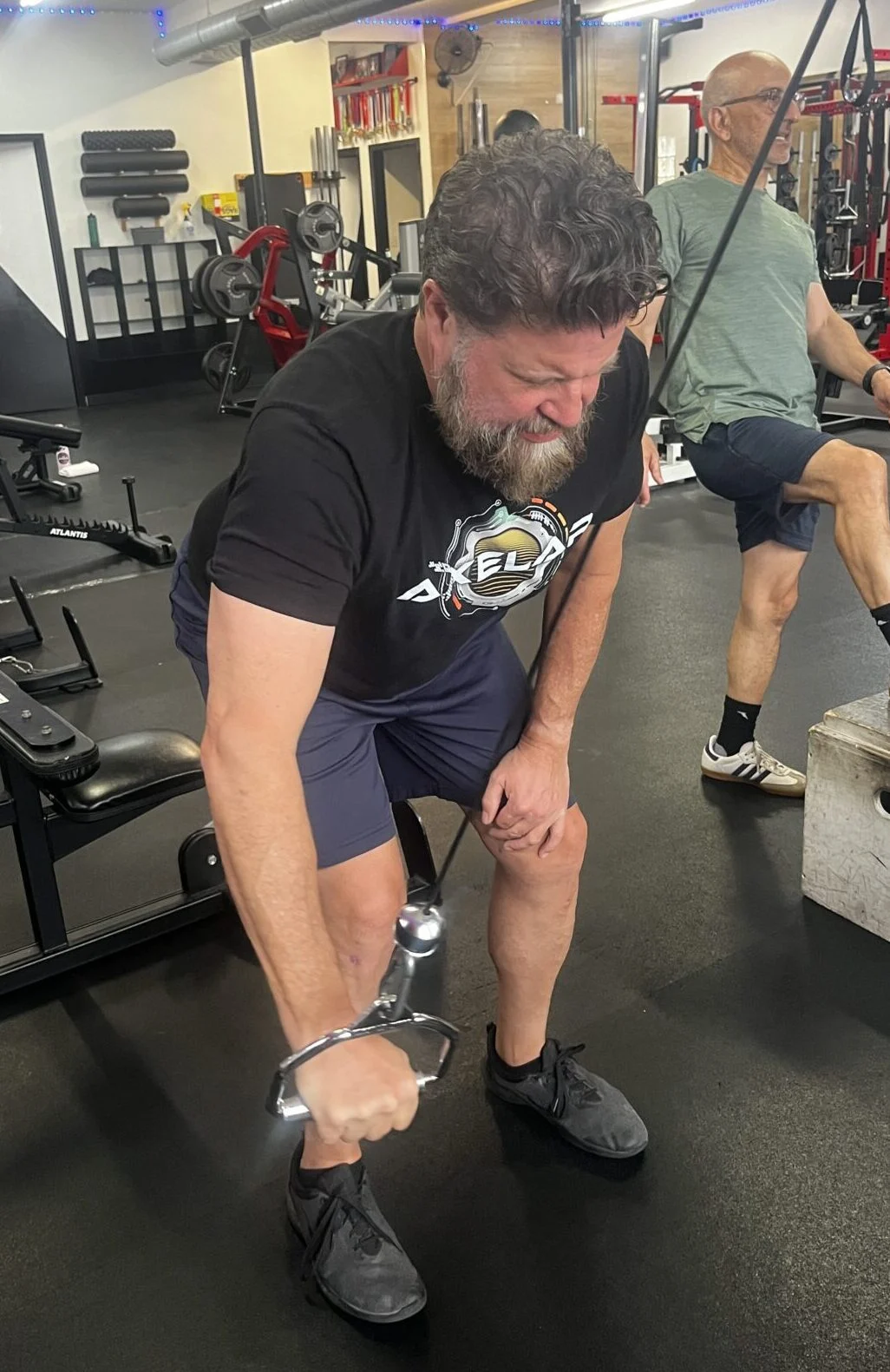 Brian doing an exercise on the cable machine