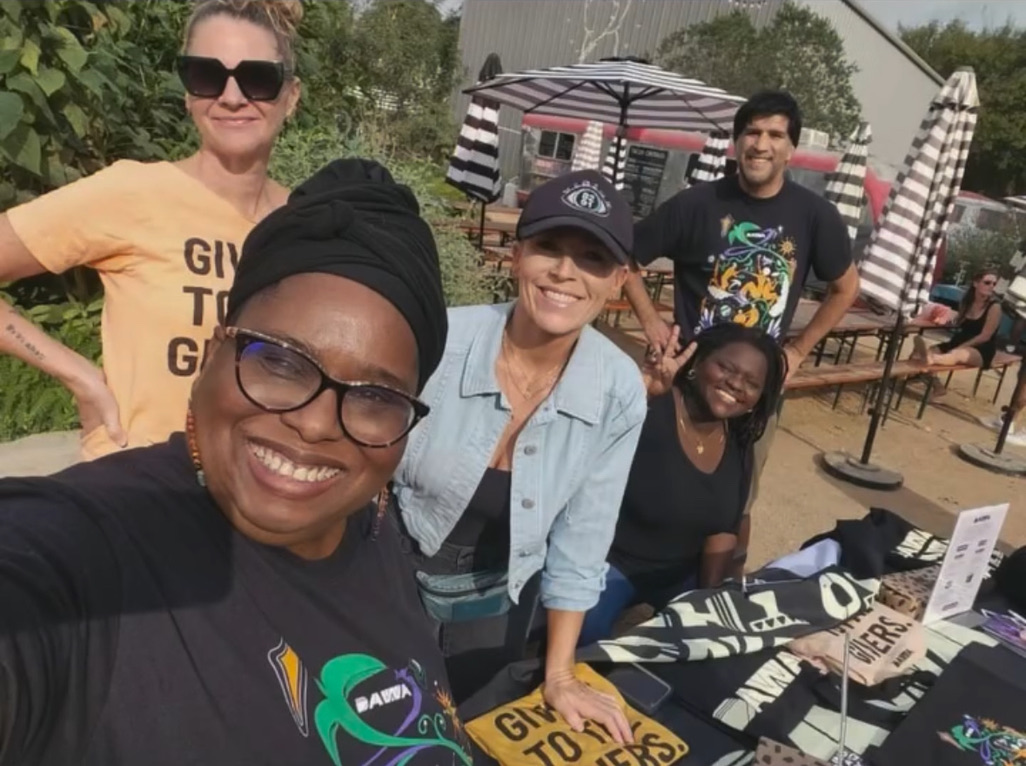 Krista Bergeron and others work a table at a DAWA event.