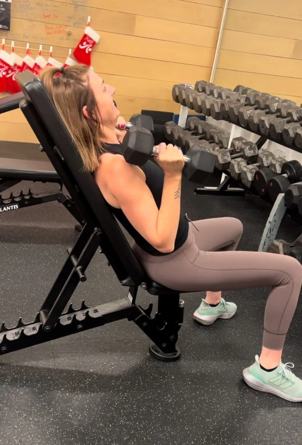 Client highlight Meredith doing an incline dumbbell bench press