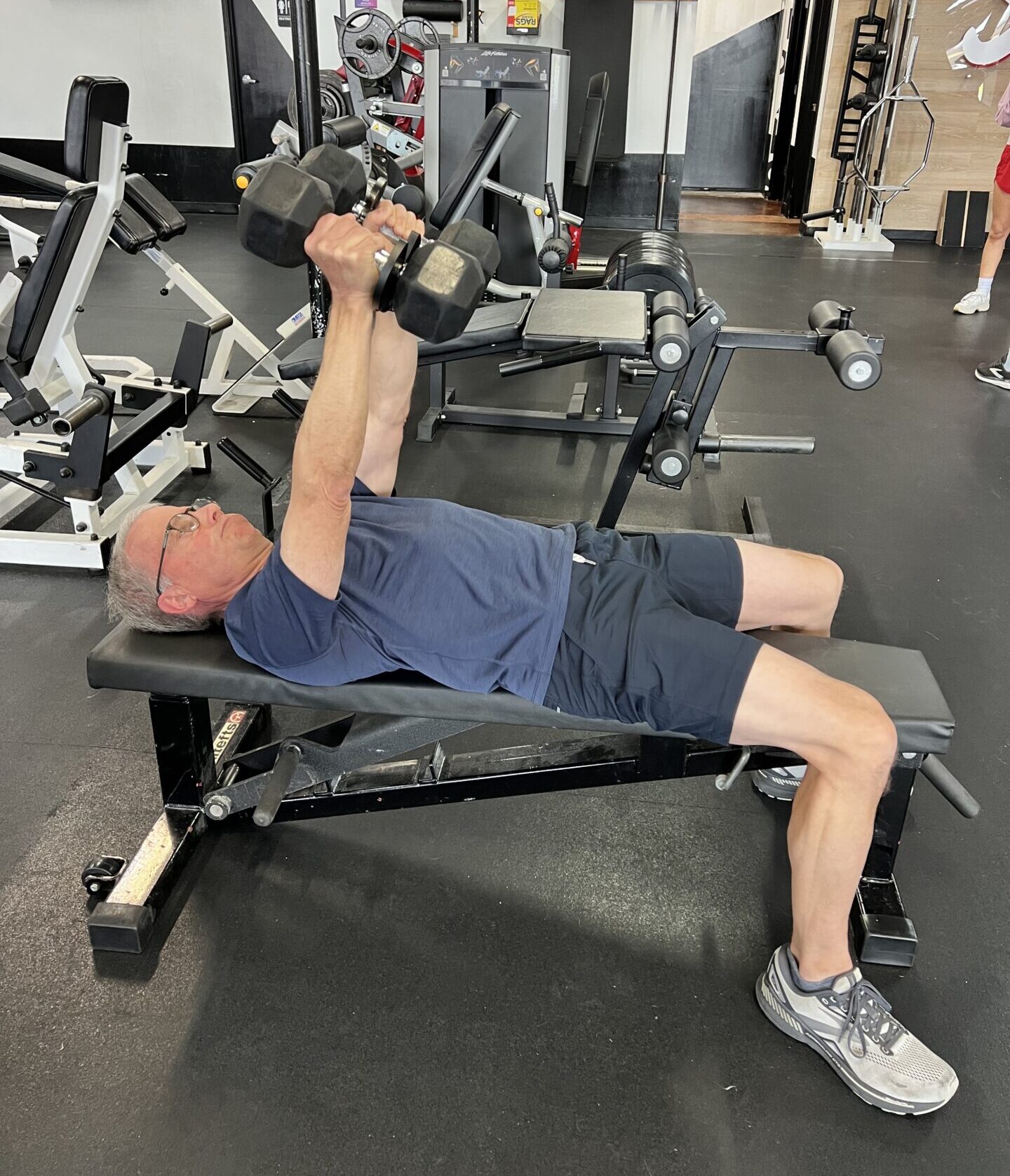 Client highlight Russ doing a dumbbell bench press