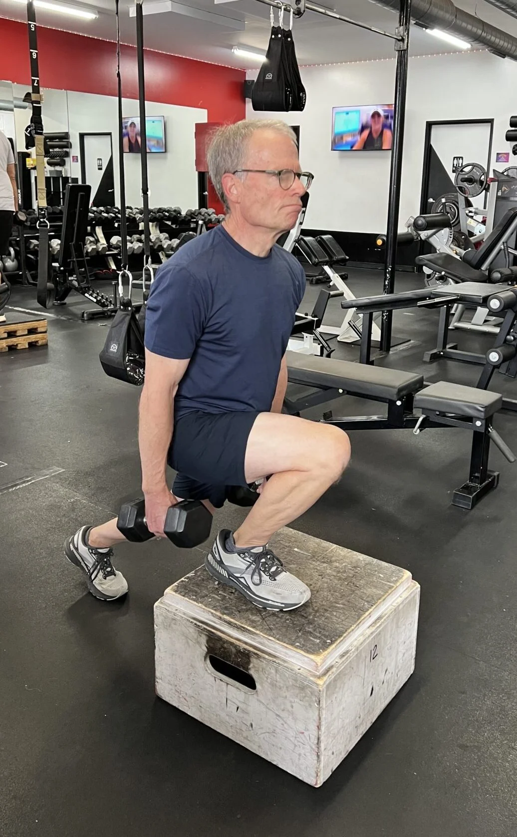 Athlete of the Month Russ performing a front foot elevated split squat