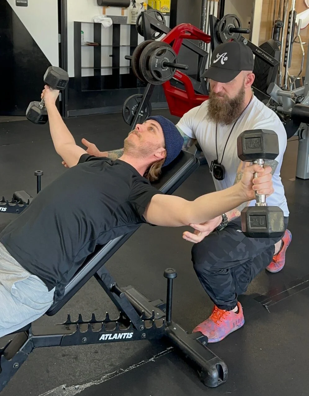 Client Highlight Nathan Franzke doing a pec flye with dumbbells