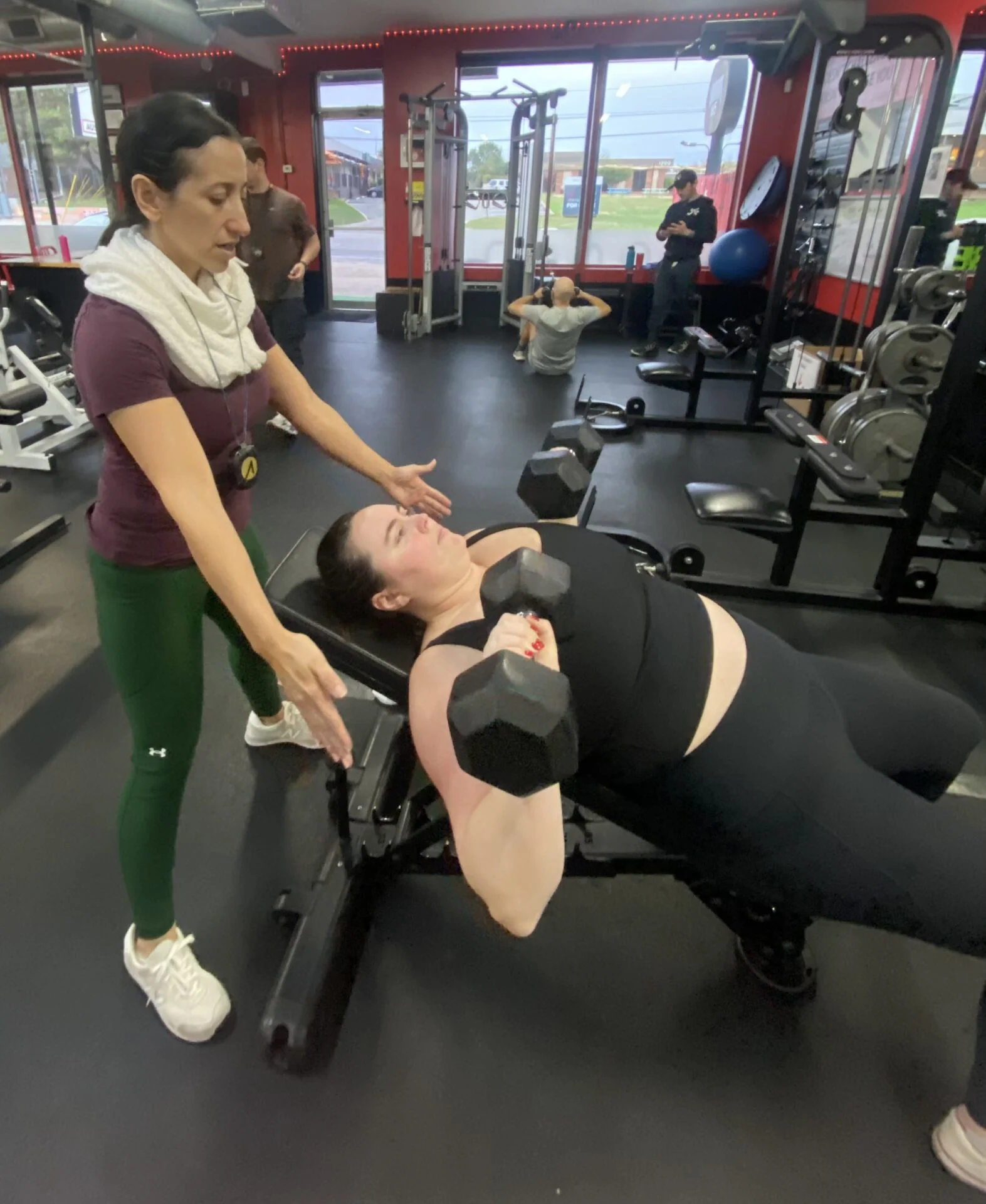 Callie performing a dumbbell bench press