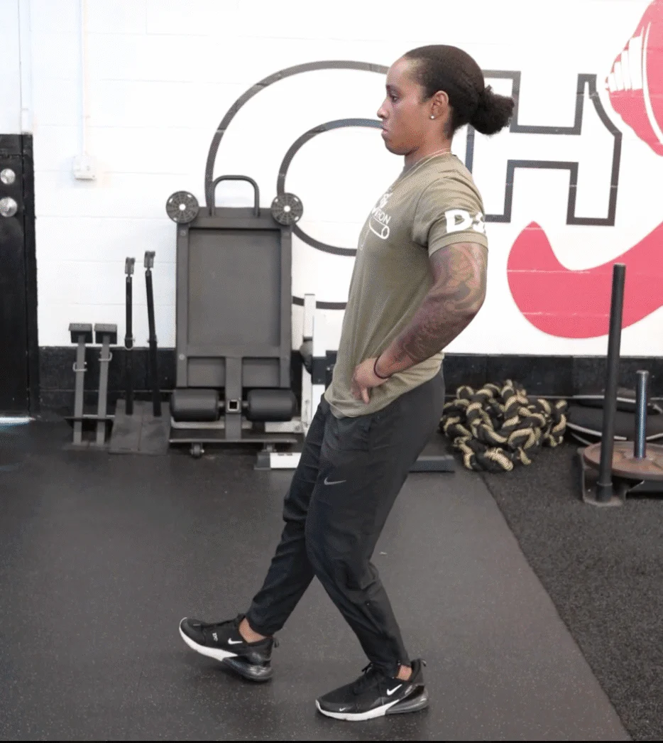 Coach Sierra doing a single leg squat test movement