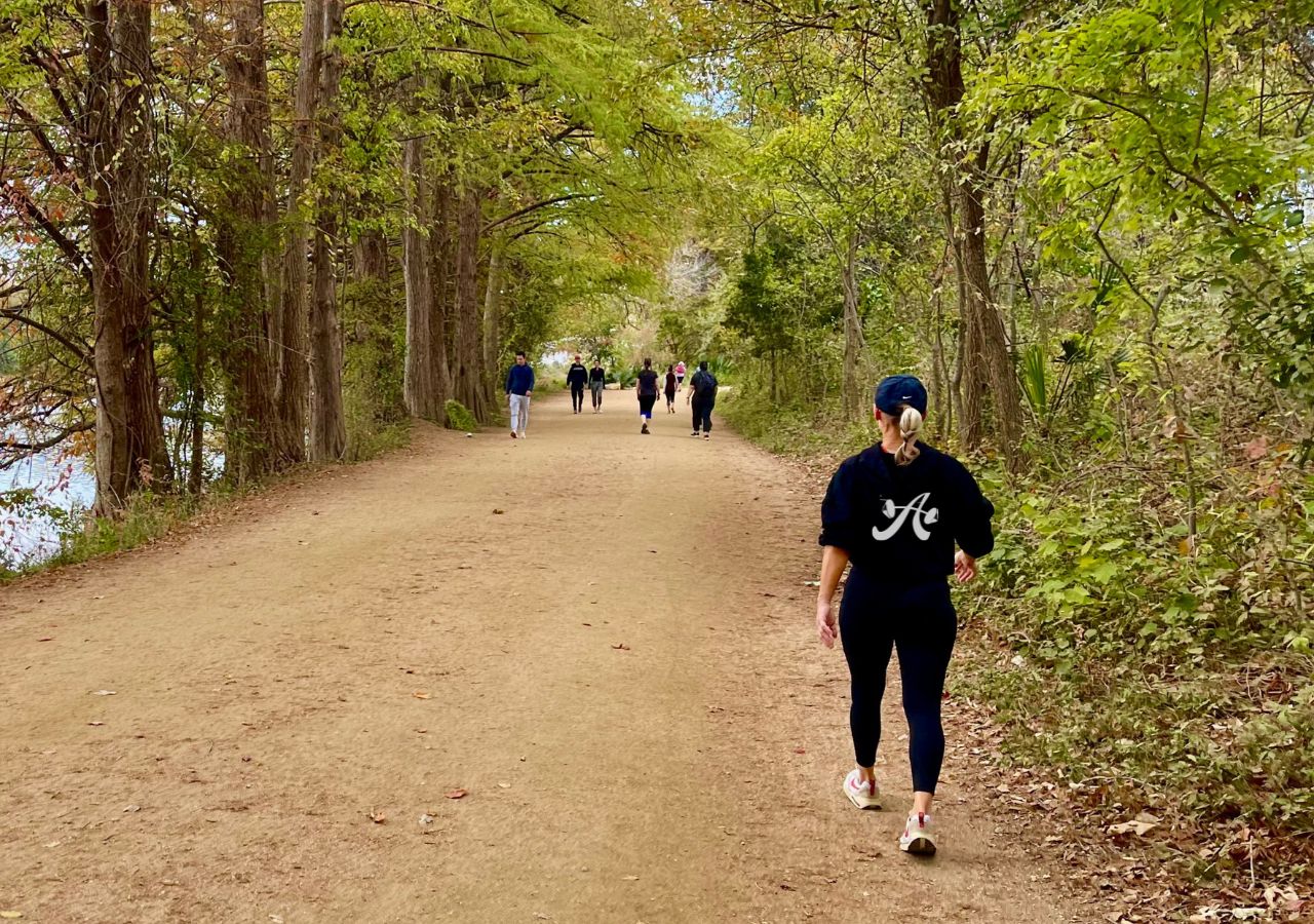 a woman walking on a trail